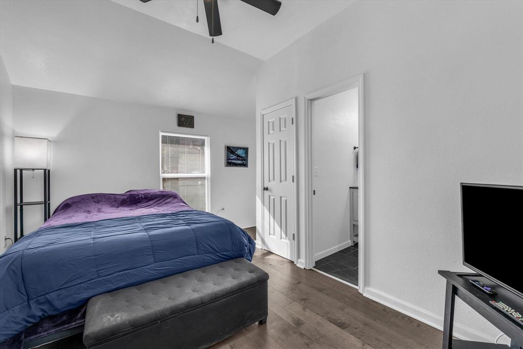 1209 Southey Street Waco, TX 76704 - Photo 5 of 21 a bedroom with a bed and a flat screen tv