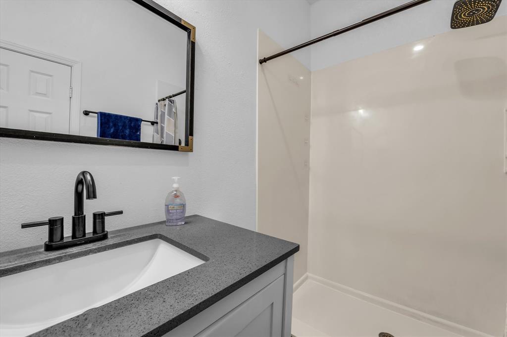 1209 Southey Street Waco, TX 76704 - Photo 6 of 21 a kitchen with a sink and a refrigerator