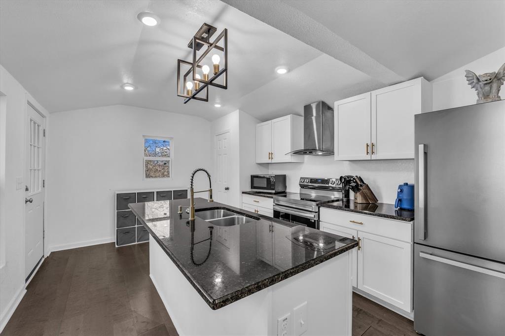 1209 Southey Street Waco, TX 76704 - Photo 8 of 21 a kitchen with stainless steel appliances granite countertop a sink a refrigerator and a stove