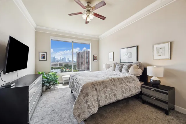 a bed room with a bed and a flat screen tv