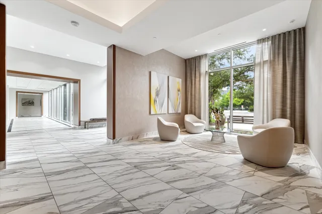 a view of backyard with table and chairs and potted plants