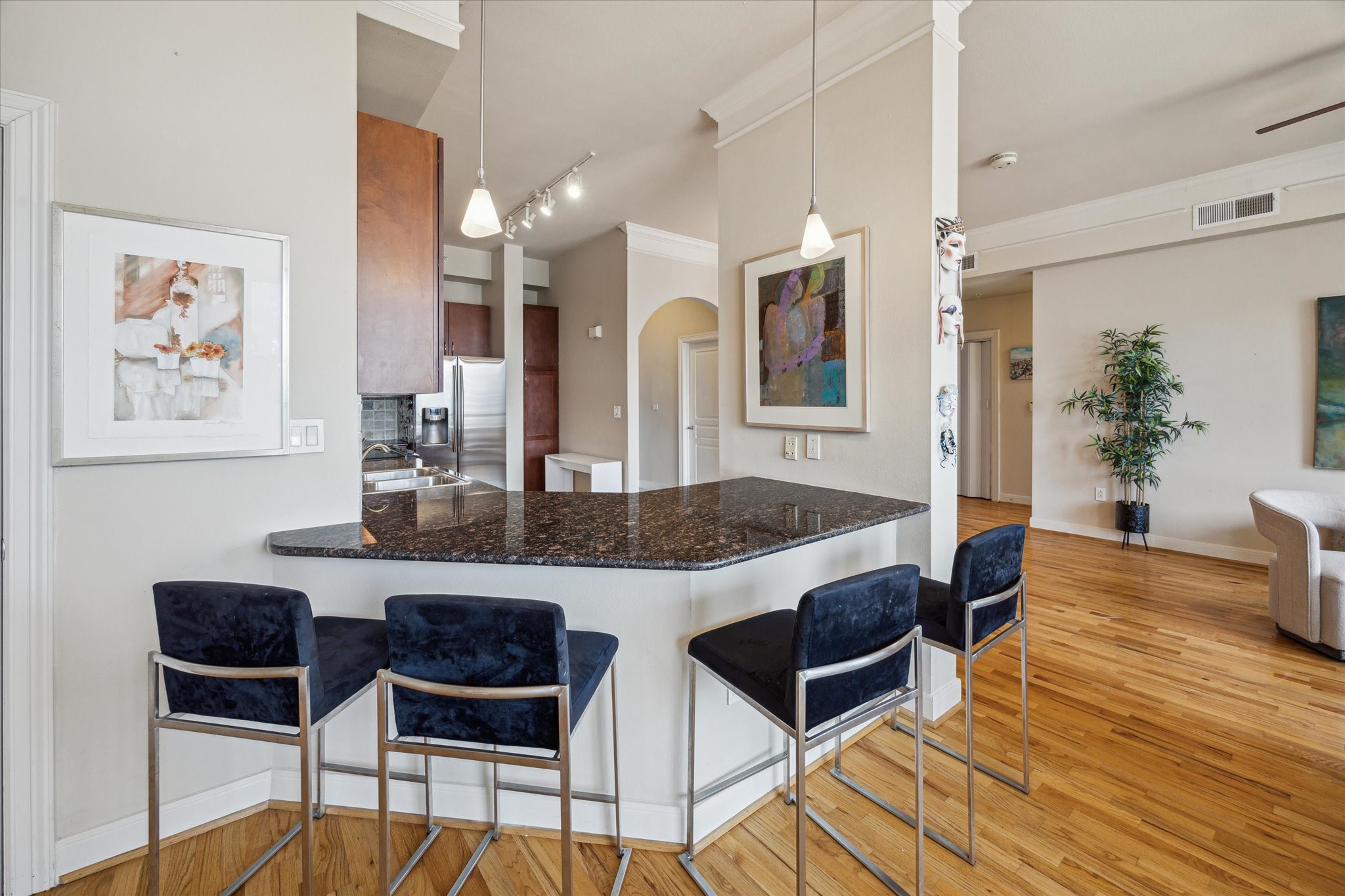 3333 Allen Parkway, Unit 1004 Houston, TX 77019 - Photo 7 of 36 a view of a dining room with furniture and wooden floor