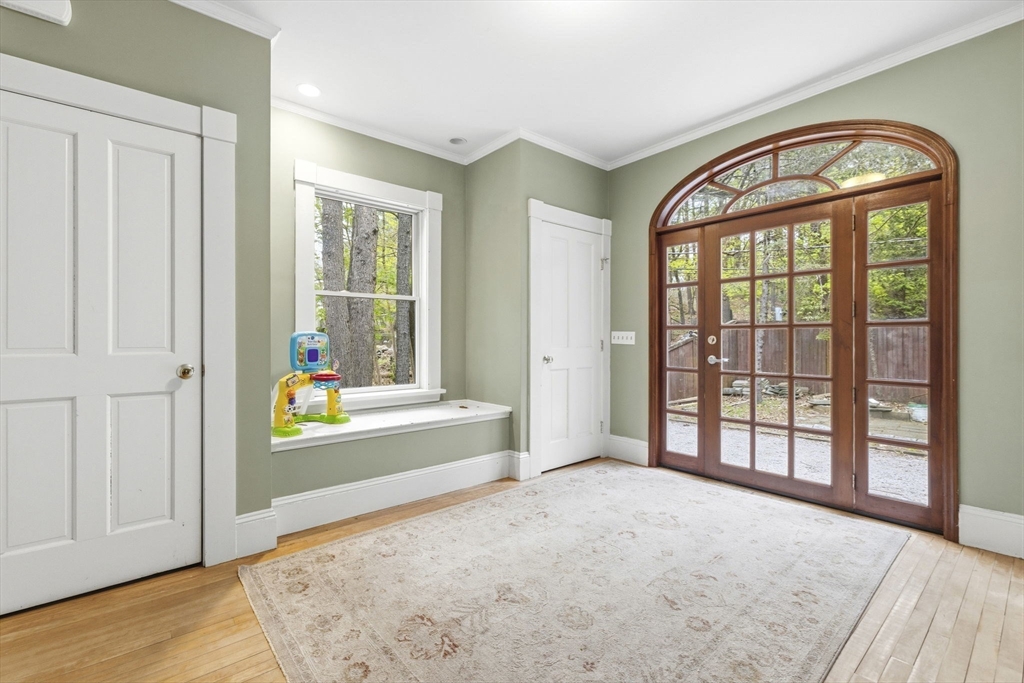 17 Wellesley Street Weston, MA 02493 - Photo 3 of 30 a view of an entryway with wooden floor and a window