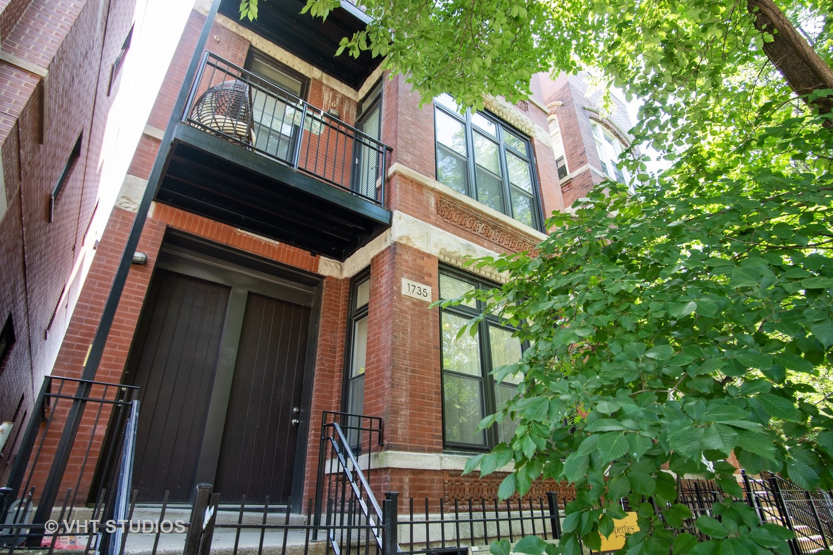 1735 West Erie Street, Unit 1N Chicago, IL 60622 - Photo 1 of 18 a building view with a outdoor space
