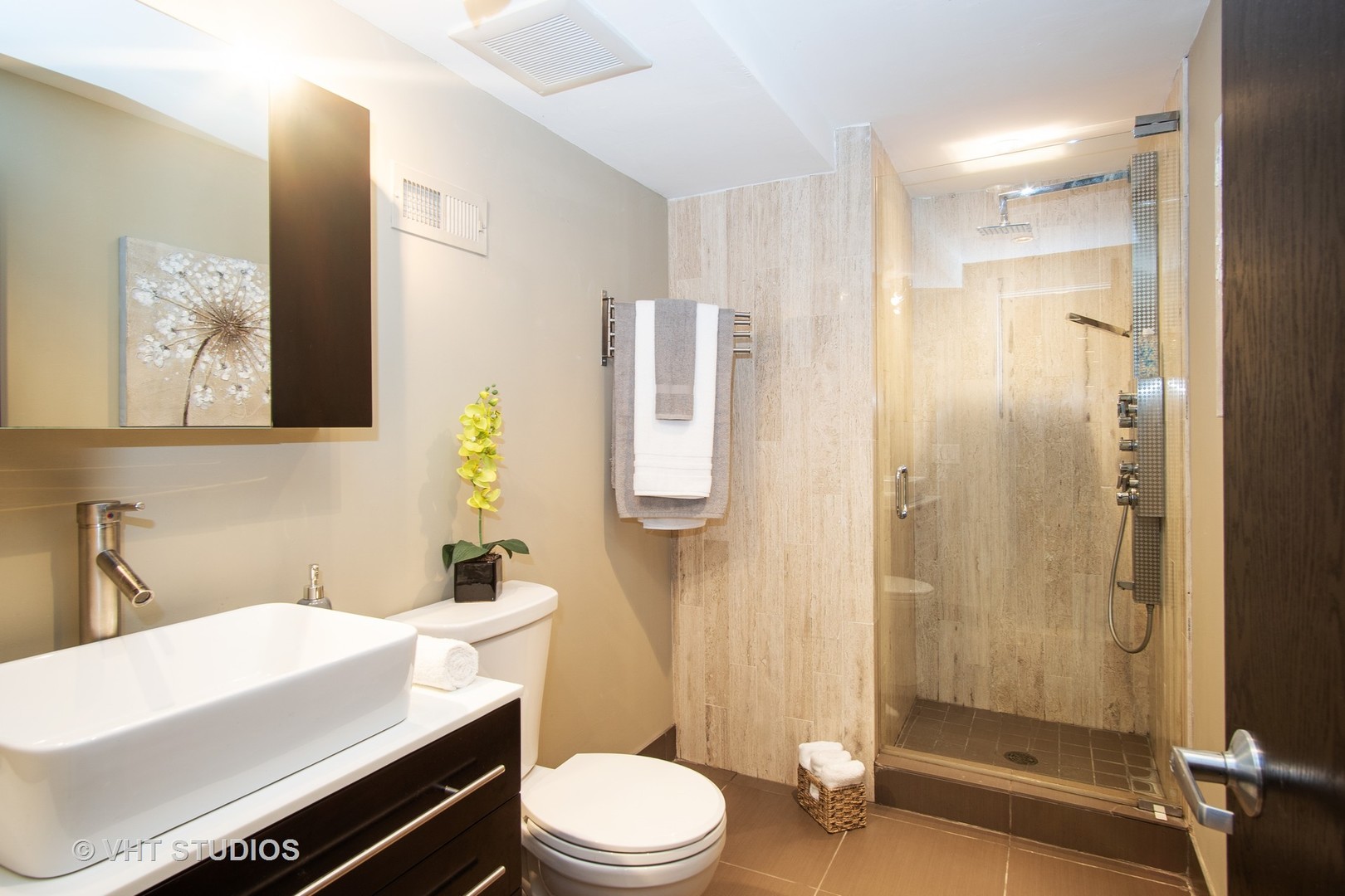 1735 West Erie Street, Unit 1N Chicago, IL 60622 - Photo 13 of 18 a bathroom with a sink a toilet and shower