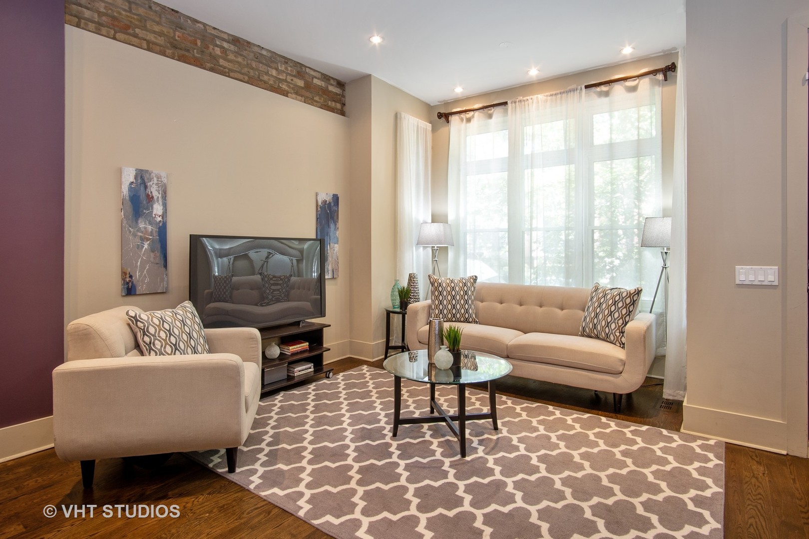 1735 West Erie Street, Unit 1N Chicago, IL 60622 - Photo 3 of 18 a living room with furniture and a large window