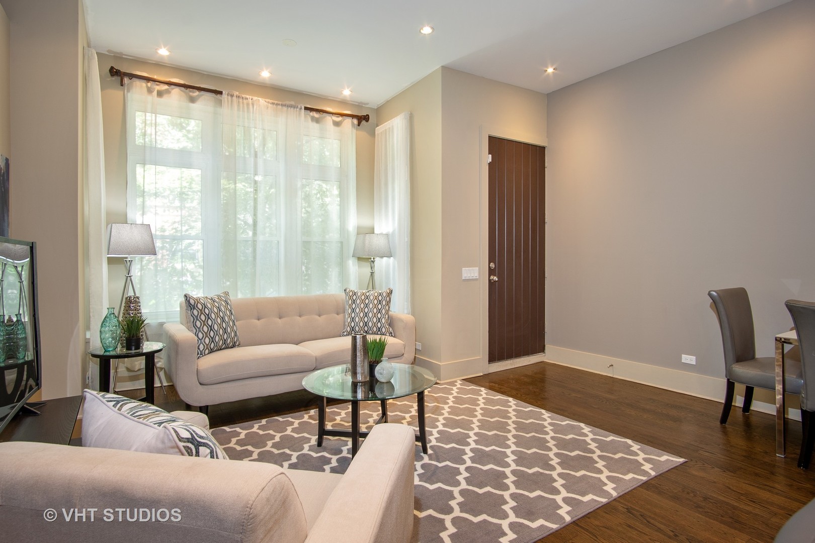 1735 West Erie Street, Unit 1N Chicago, IL 60622 - Photo 4 of 18 a living room with furniture and a rug