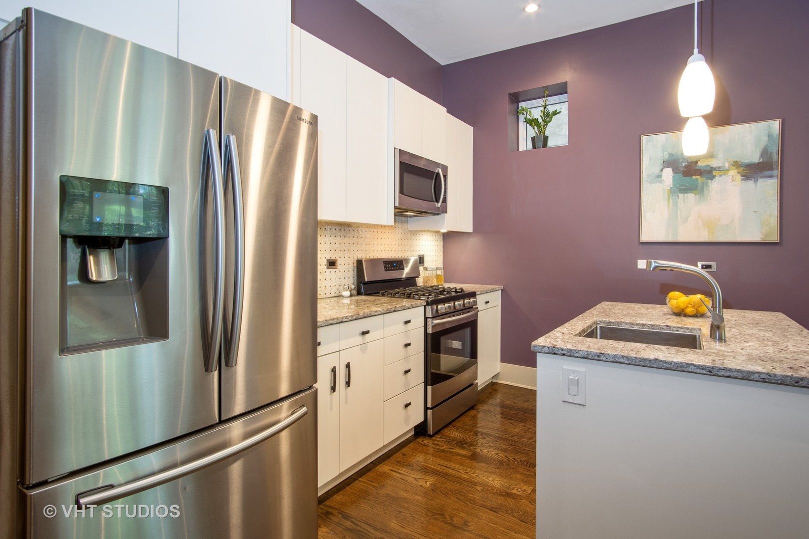 1735 West Erie Street, Unit 1N Chicago, IL 60622 - Photo 5 of 18 a kitchen with stainless steel appliances granite countertop a refrigerator a stove a sink dishwasher and a refrigerator with wooden floor