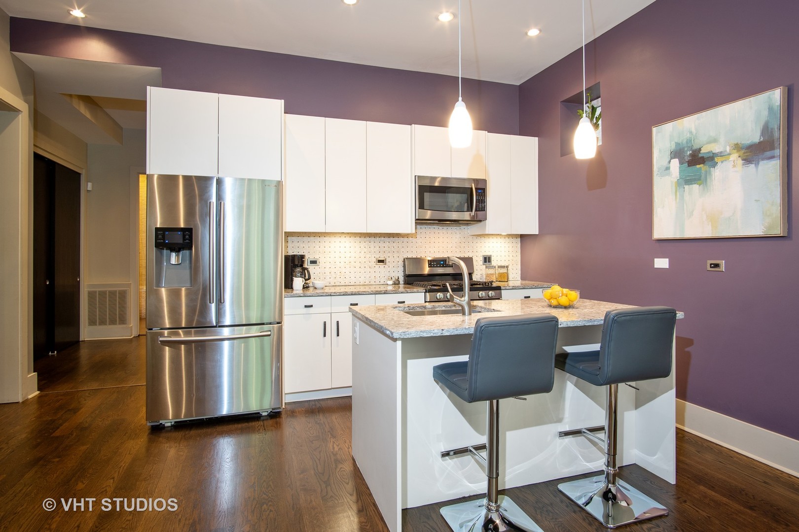 1735 West Erie Street, Unit 1N Chicago, IL 60622 - Photo 6 of 18 a kitchen with stainless steel appliances a refrigerator stove microwave and sink