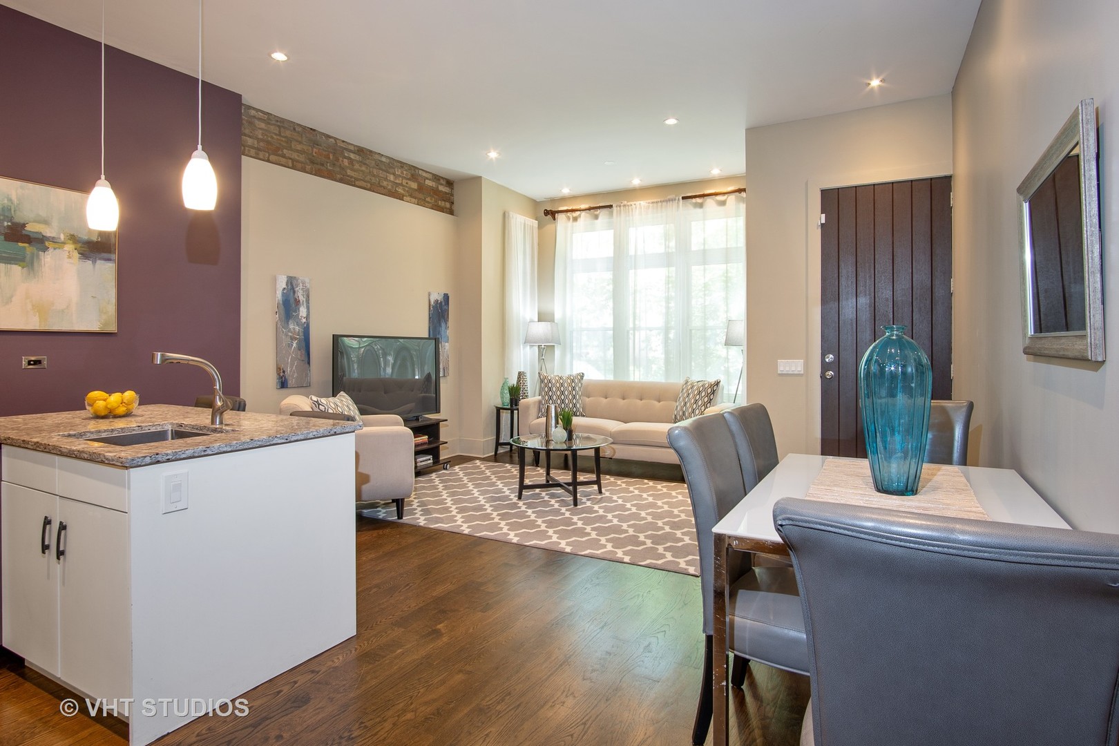 1735 West Erie Street, Unit 1N Chicago, IL 60622 - Photo 7 of 18 a living room with furniture and a table