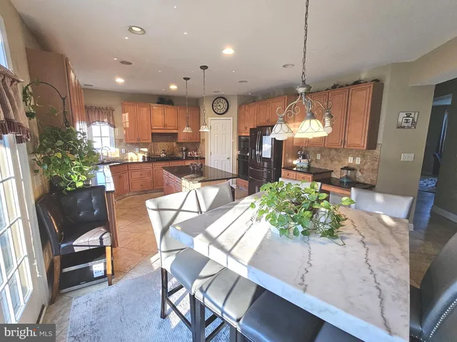 a view of a dining area with furniture window and wooden floor
