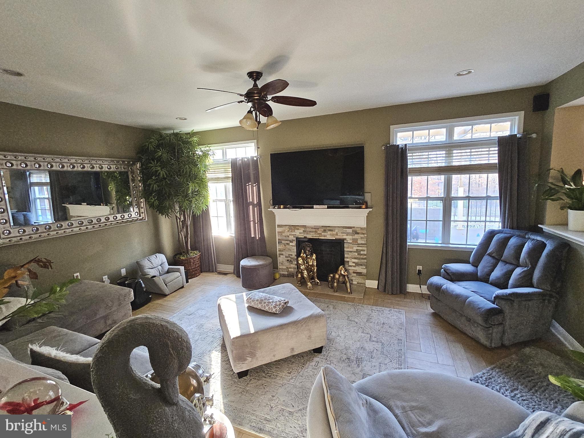 624 Nesting Lane Middletown, DE 19709 - Photo 17 of 50 a living room with furniture a fireplace and a flat screen tv