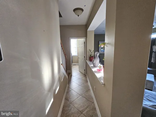 a view of a hallway view with staircase