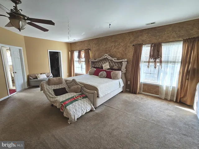 a bed room with a bed and a window