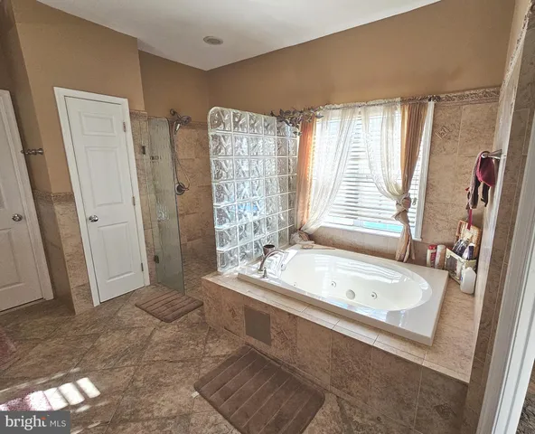 a bathroom with a shower and a sink