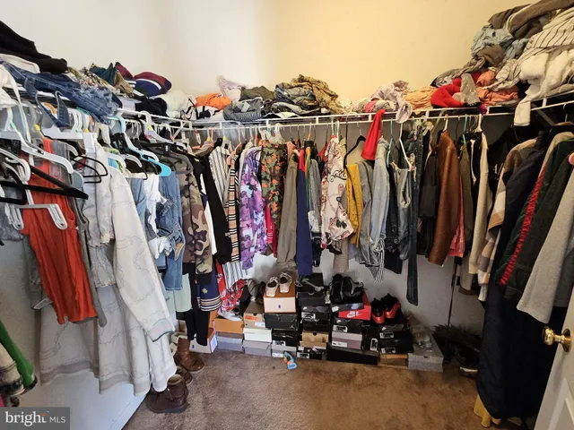 a bedroom with bed and a window