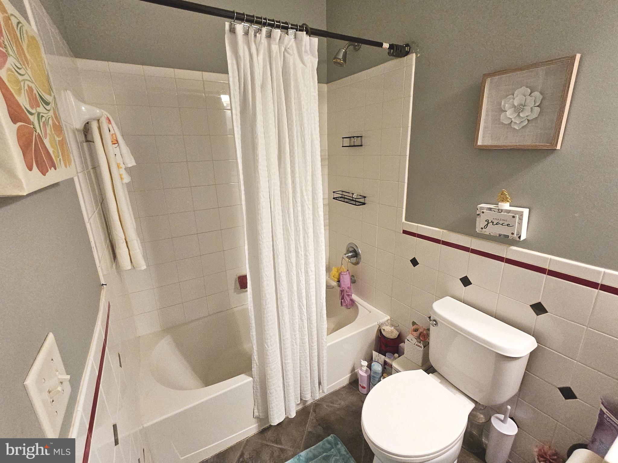 624 Nesting Lane Middletown, DE 19709 - Photo 41 of 50 a white toilet sitting next to a bathroom sink