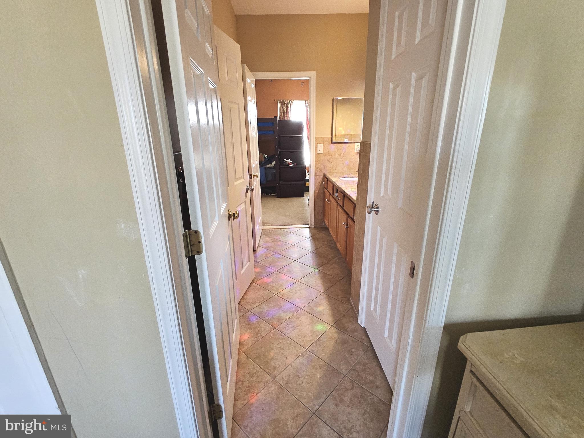 624 Nesting Lane Middletown, DE 19709 - Photo 45 of 50 a view of a hallway with a livingroom and a bathroom