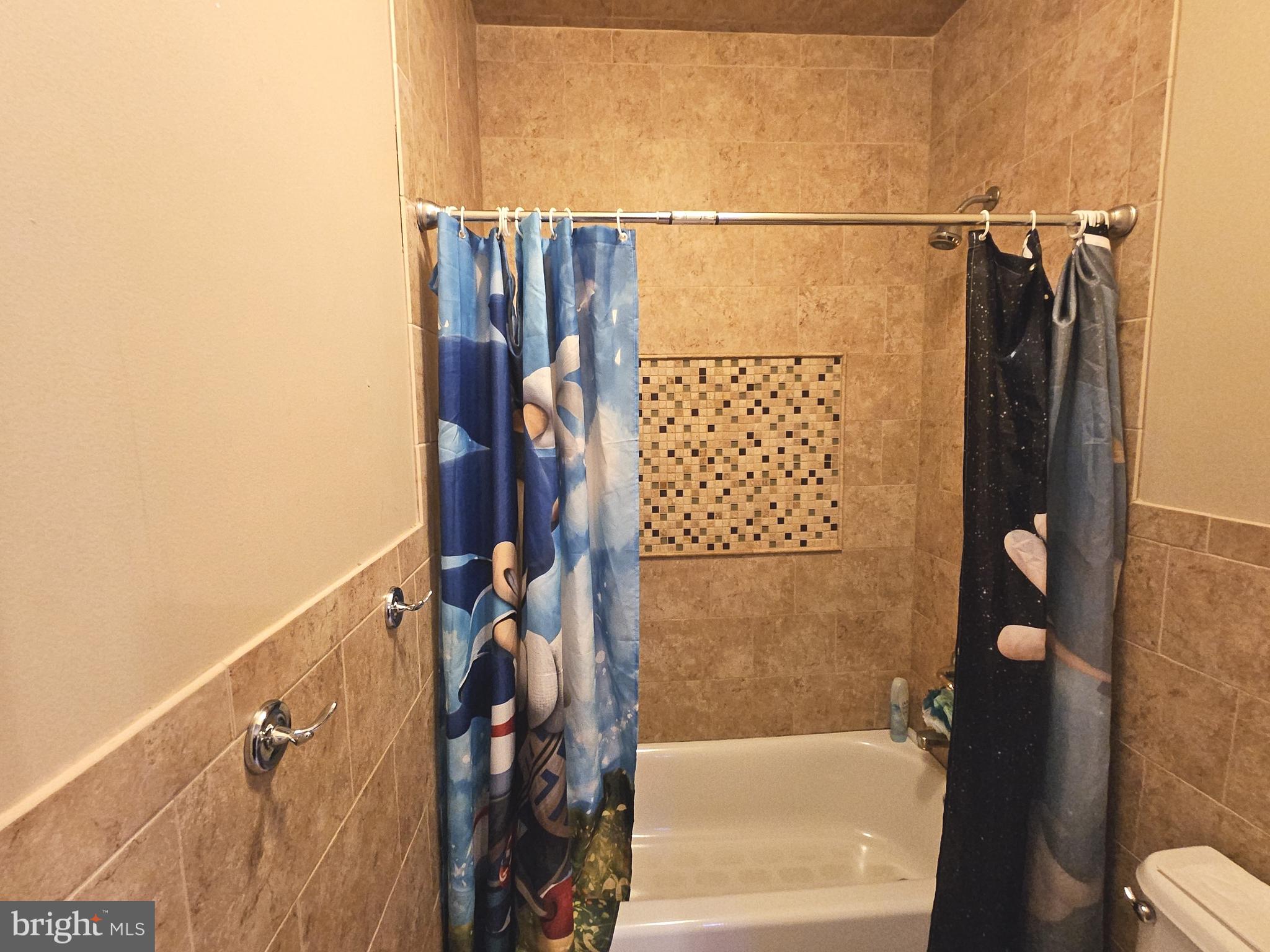 624 Nesting Lane Middletown, DE 19709 - Photo 46 of 50 a bathroom with a shower and a tub