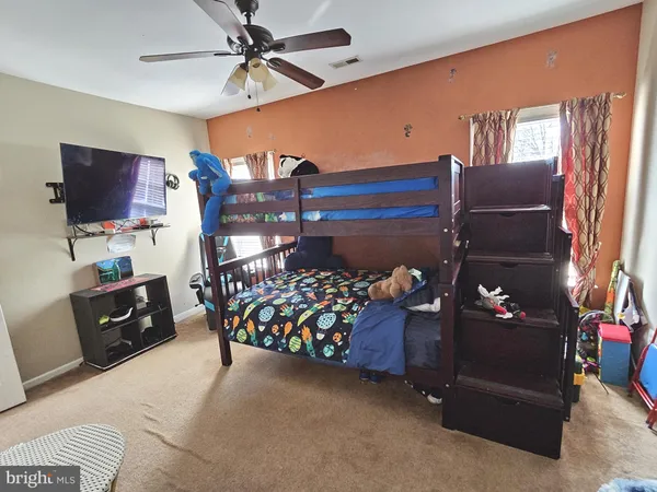 a bedroom with furniture and windows