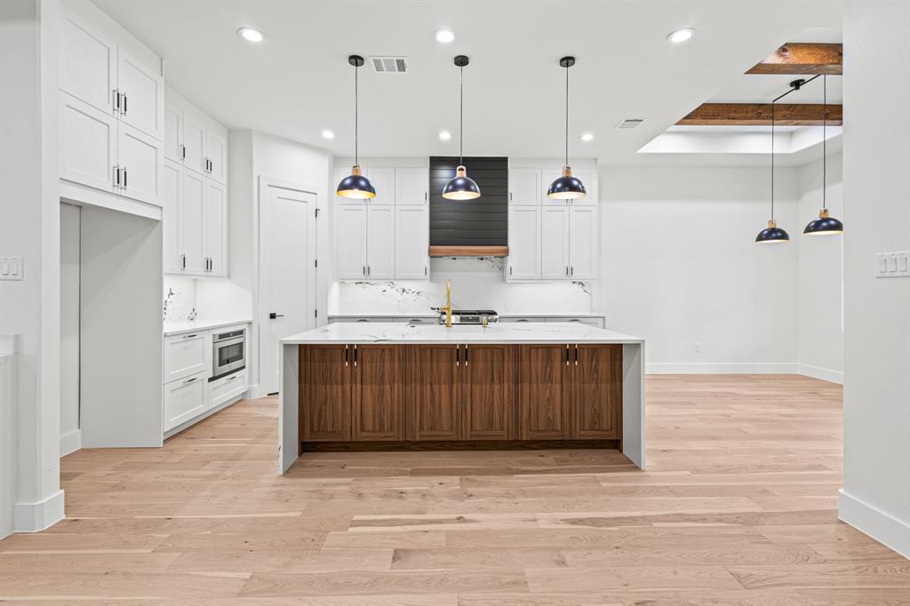 4016 Baker Avenue Dallas, TX 75212 - Photo 15 of 38 a bathroom with a sink a mirror and shower
