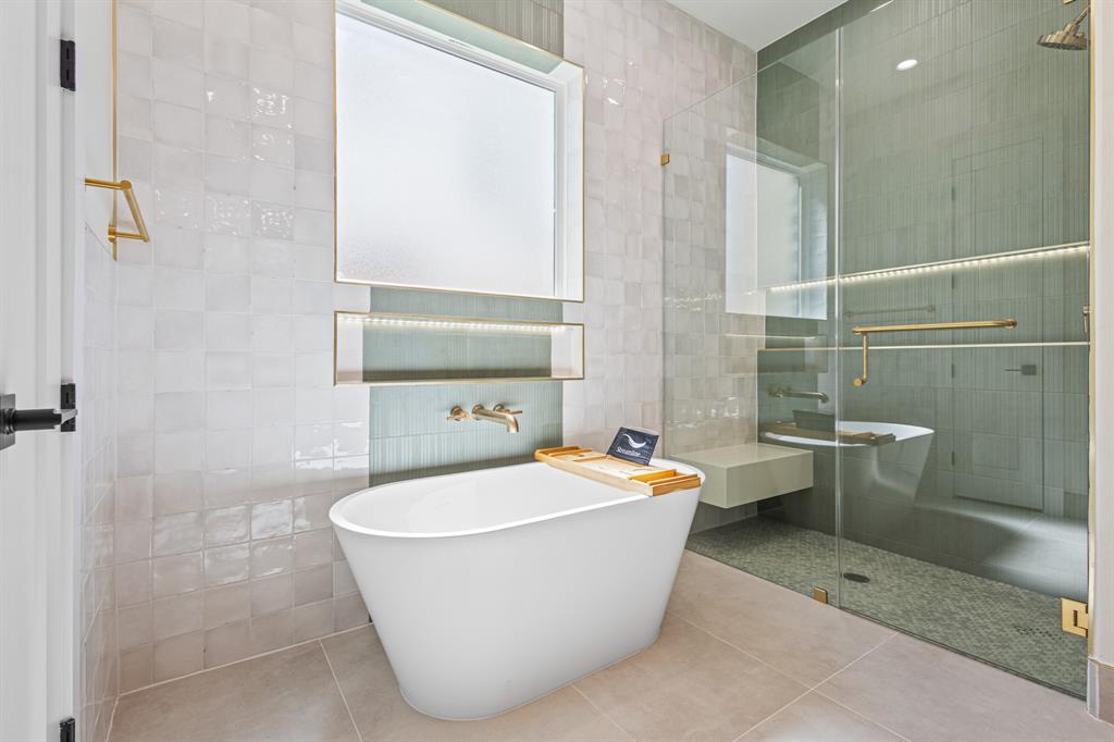 4016 Baker Avenue Dallas, TX 75212 - Photo 23 of 38 a white bath tub sitting next to a white toilet