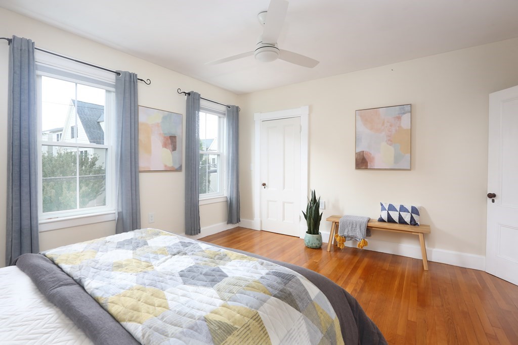 195 Fayette Street Watertown, MA 02472 - Photo 12 of 18 a bedroom with a bed and wooden floor