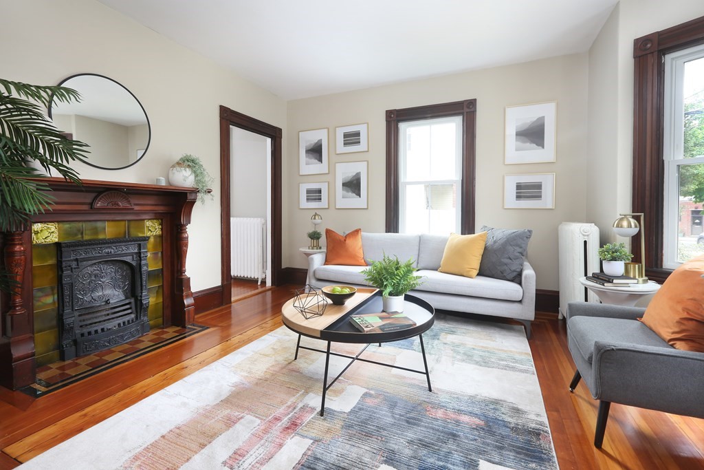 195 Fayette Street Watertown, MA 02472 - Photo 3 of 18 a living room with furniture a window and a fireplace