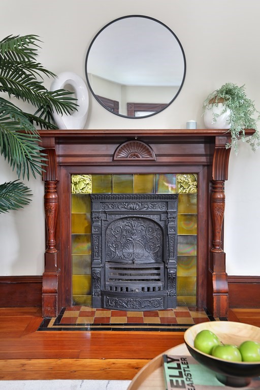 195 Fayette Street Watertown, MA 02472 - Photo 5 of 18 a view of fireplace with a wooden floor