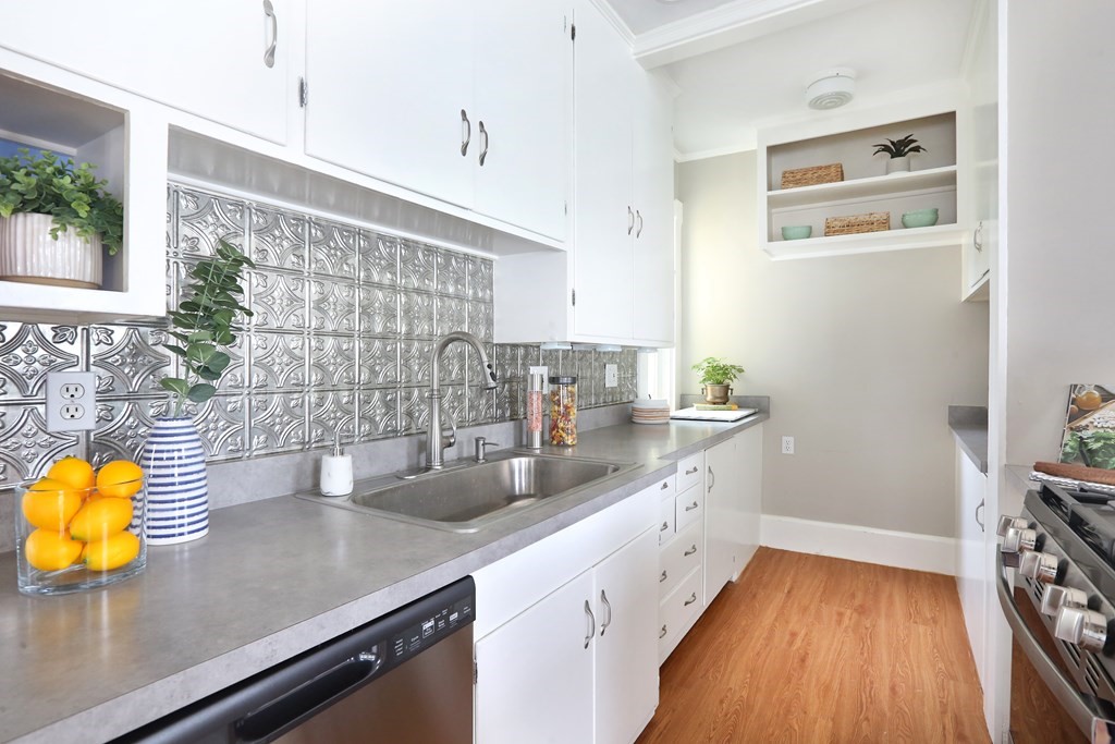 195 Fayette Street Watertown, MA 02472 - Photo 8 of 18 a kitchen with a sink and wooden floor