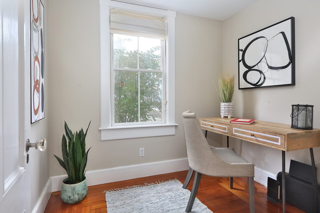 195 Fayette Street Watertown, MA 02472 - Photo 9 of 18 a view of a workspace with furniture and a potted plant
