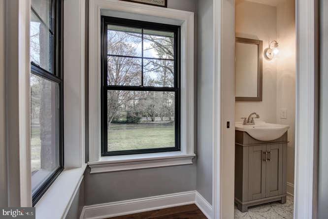 201 Brookhaven Road Wallingford, PA 19086 - Photo 6 of 25 Pocket doors to the attractive Powder Room