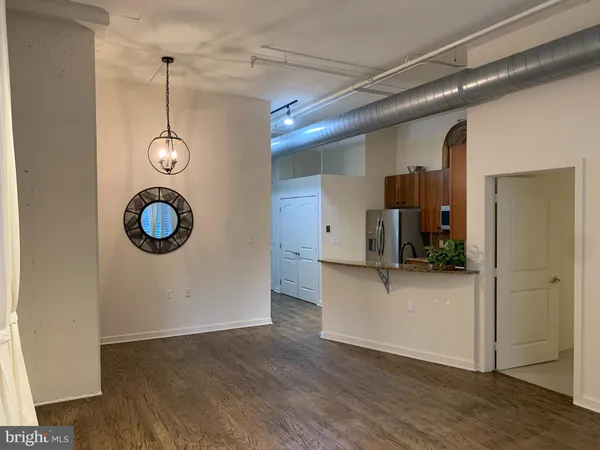 an empty room with a empty space and windows