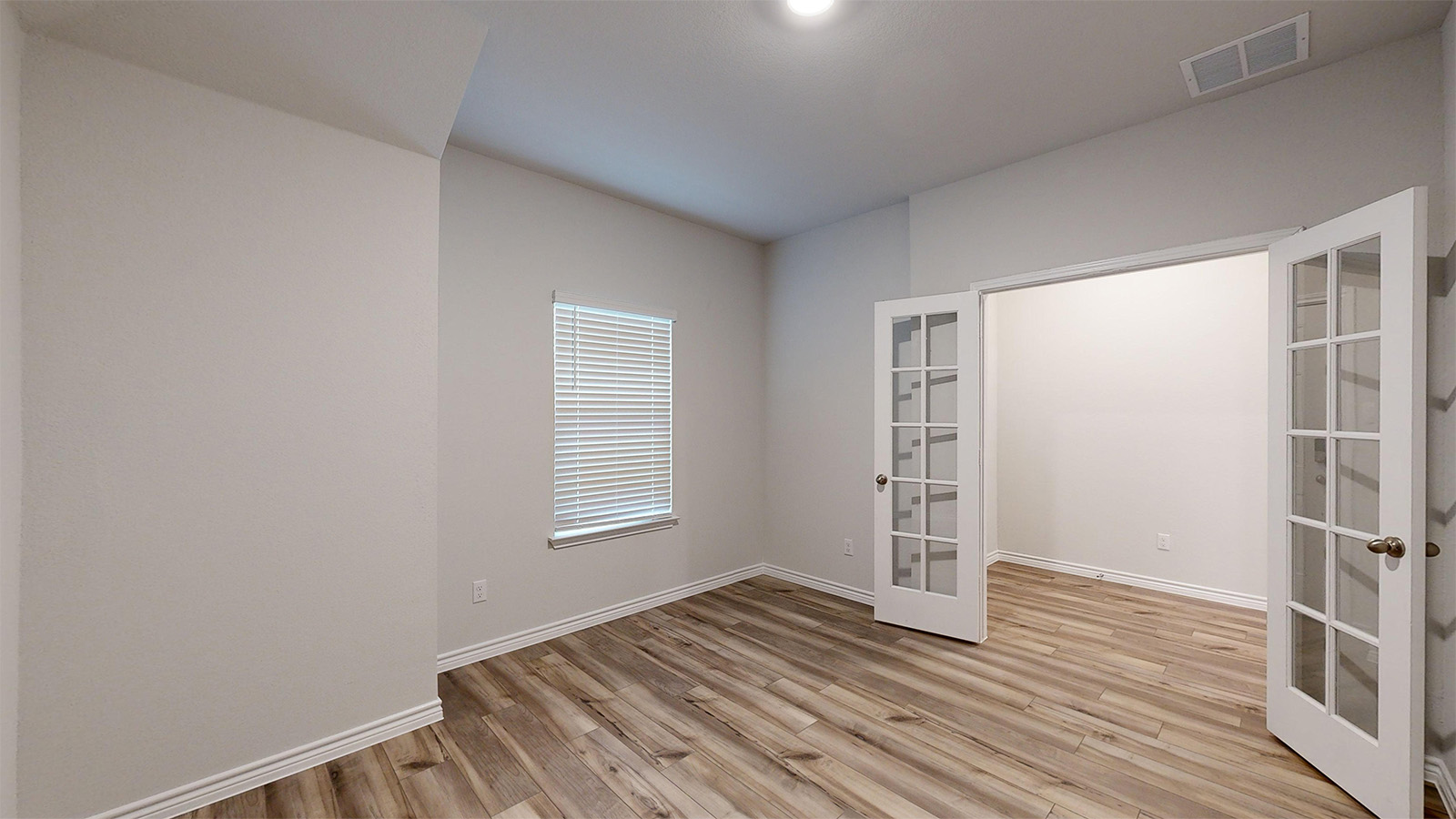 700 Gauge Road Thorndale, TX 76577 - Photo 8 of 22 Unfurnished room with french doors and light wood-style floors