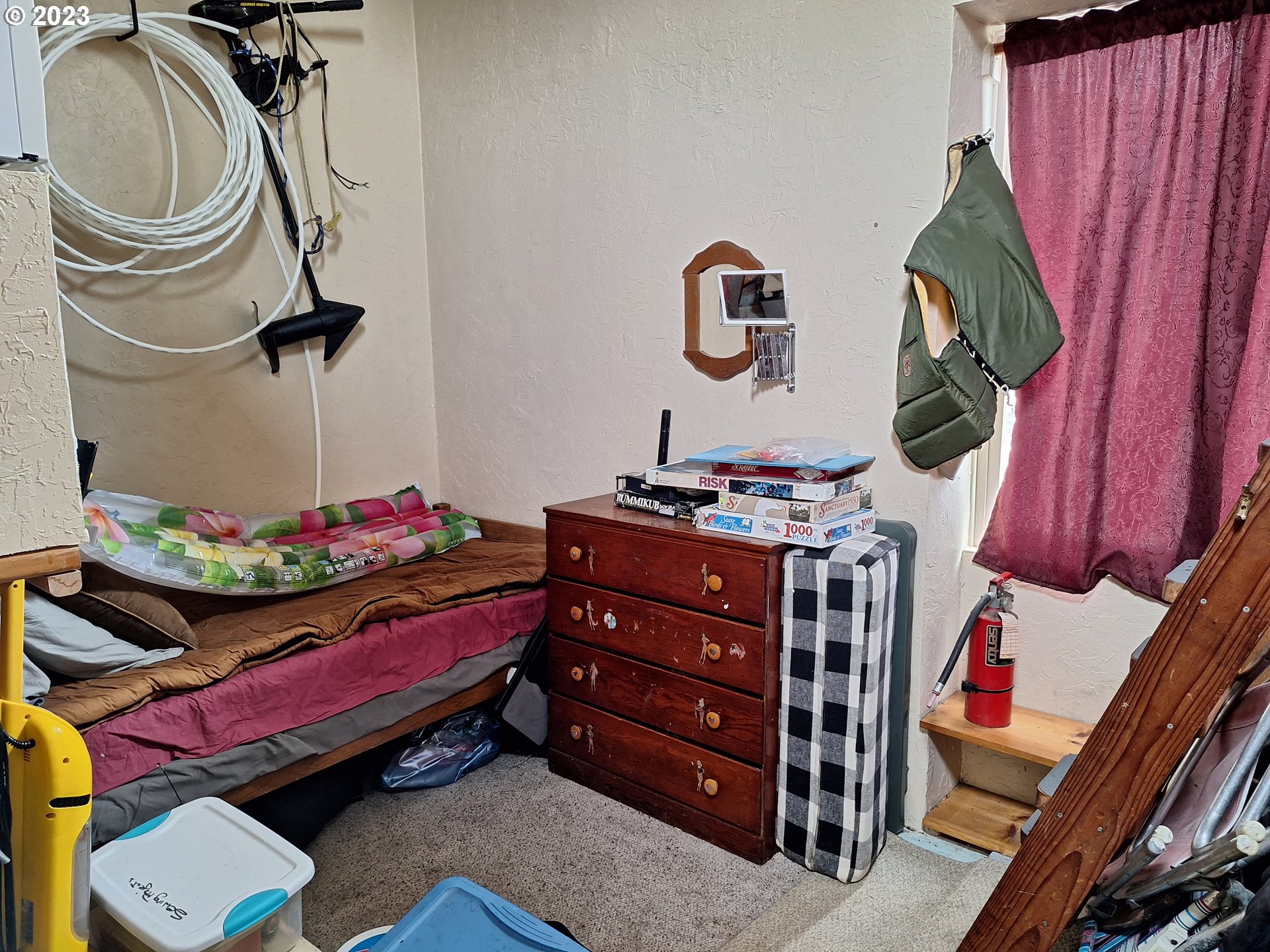 Tahkenitch Gardiner, OR 97441 - Photo 7 of 12 a bedroom with a bed and cabinets
