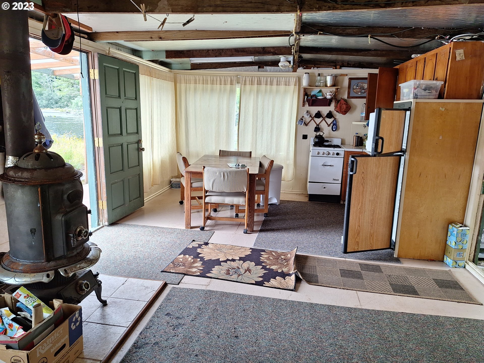 Tahkenitch Gardiner, OR 97441 - Photo 10 of 12 a living room with furniture and a fireplace