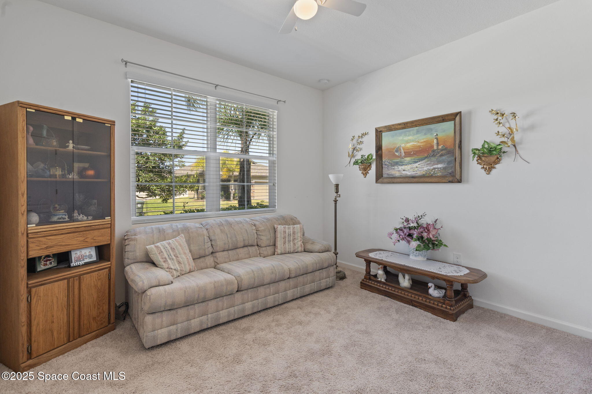 4015 Harvest Circle Rockledge, FL 32955 - Photo 16 of 40 a living room with furniture and a window