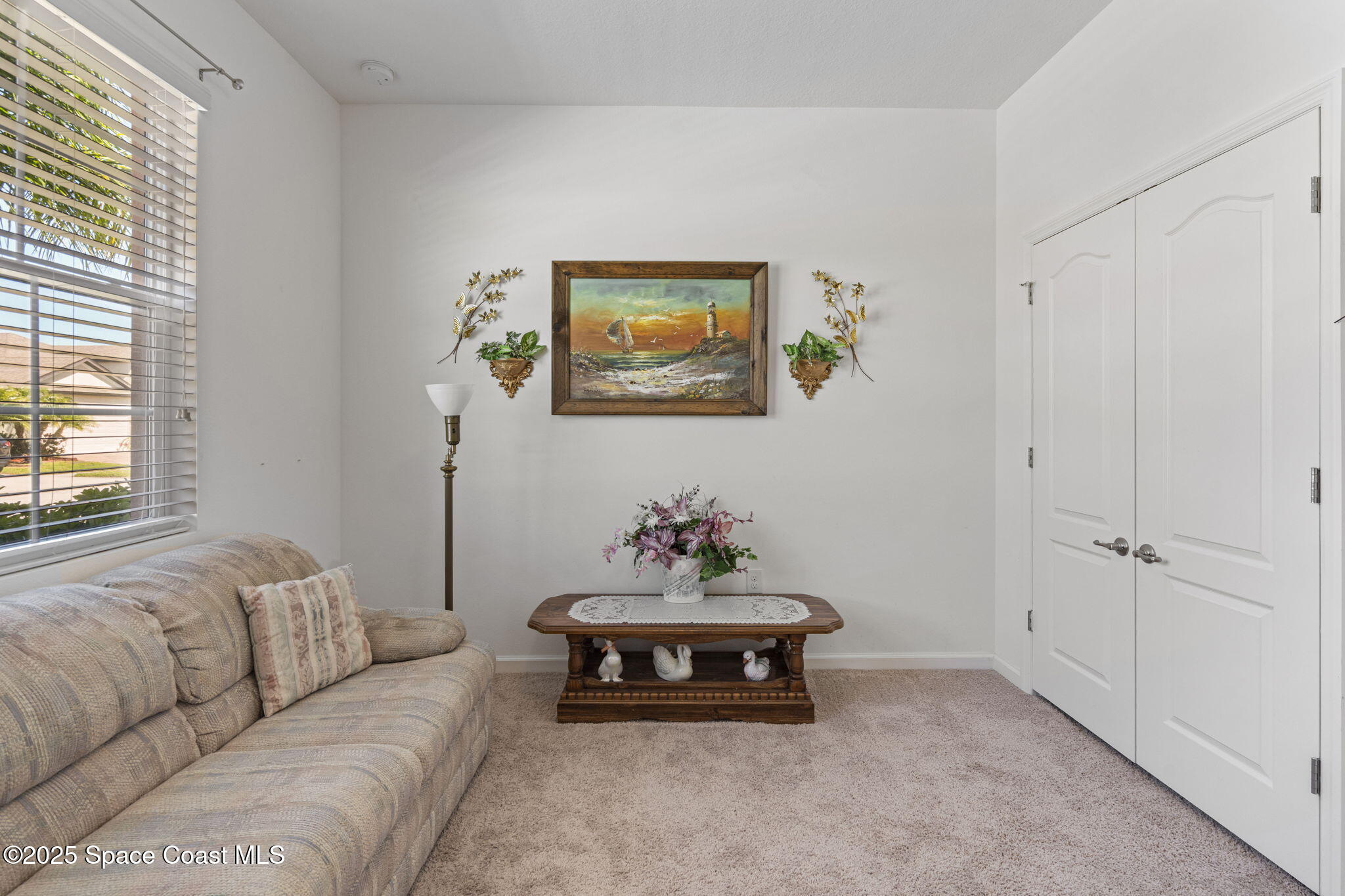 4015 Harvest Circle Rockledge, FL 32955 - Photo 17 of 40 a living room with furniture and a window