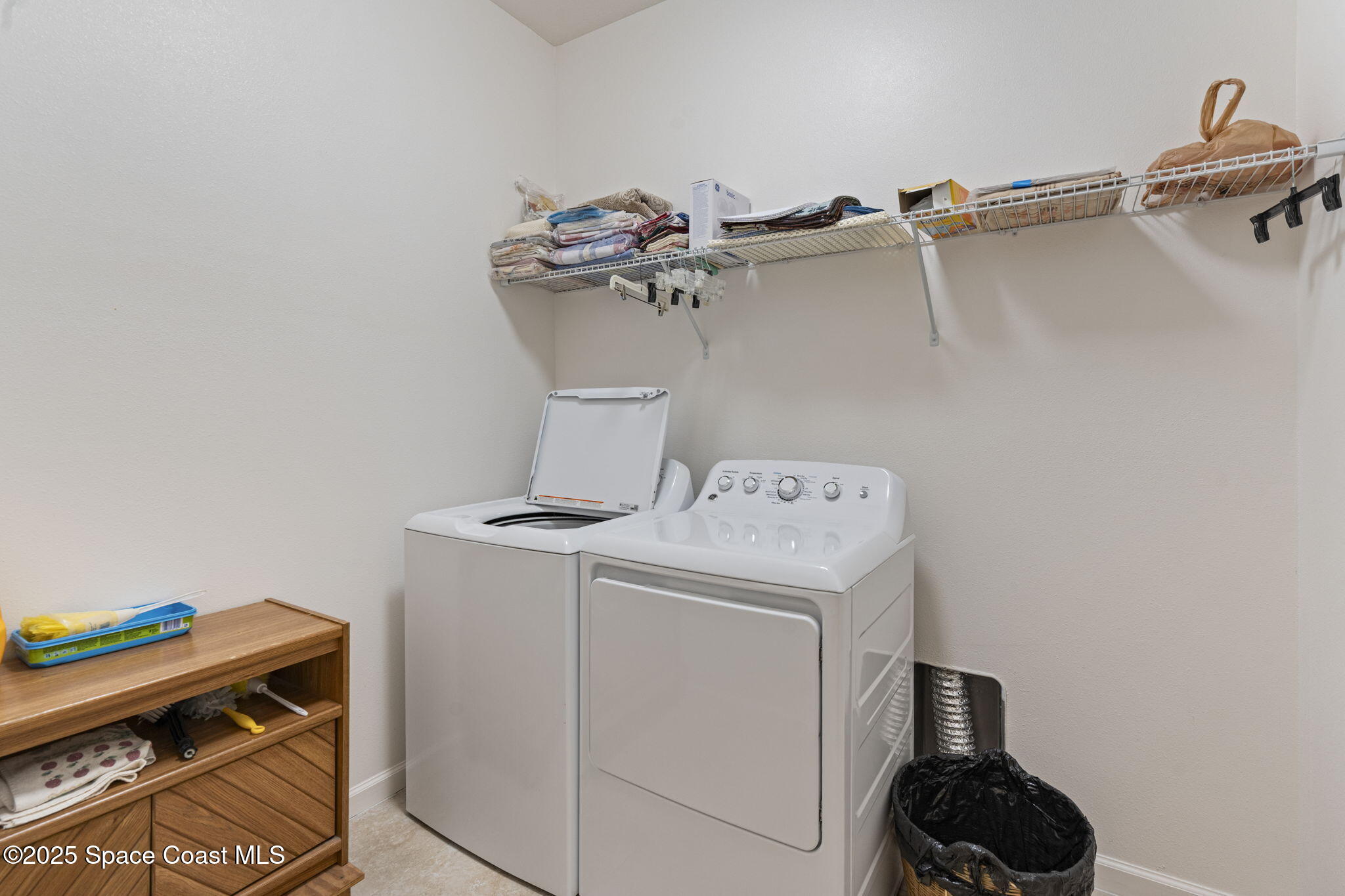 4015 Harvest Circle Rockledge, FL 32955 - Photo 23 of 40 a utility room with dryer and washer