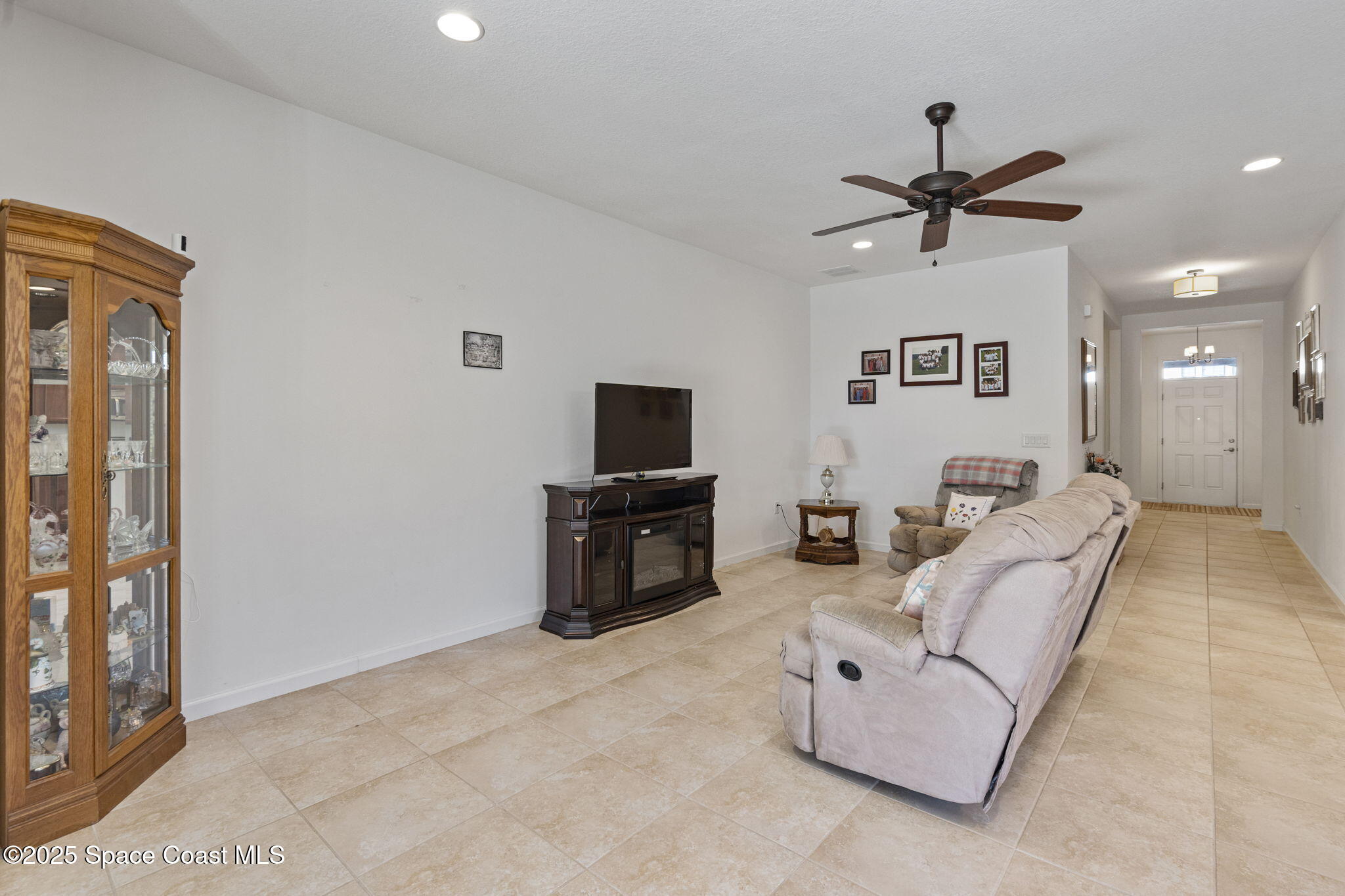 4015 Harvest Circle Rockledge, FL 32955 - Photo 25 of 40 a living room with furniture and a flat screen tv