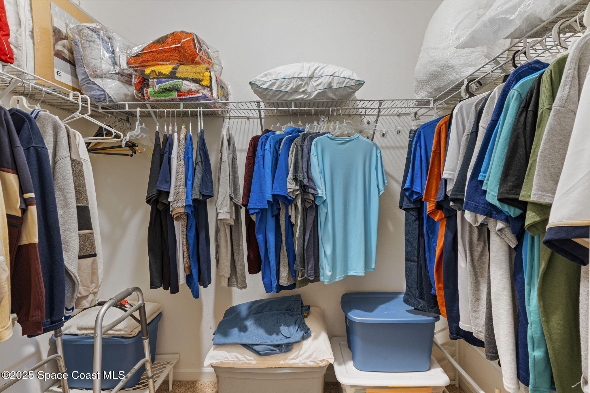 4015 Harvest Circle Rockledge, FL 32955 - Photo 31 of 40 a view of walk in closet with clothes and shoes