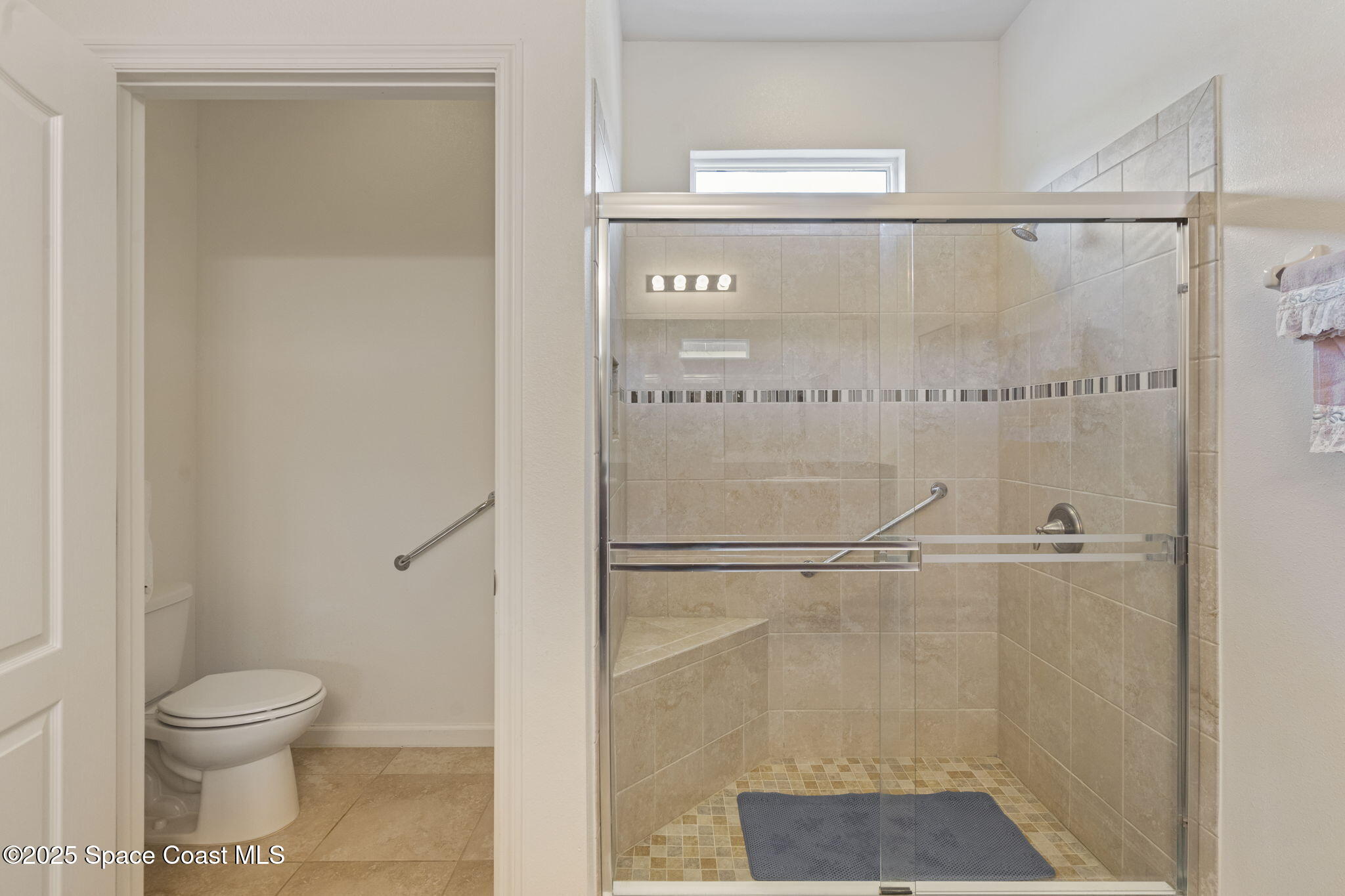 4015 Harvest Circle Rockledge, FL 32955 - Photo 33 of 40 a bathroom with a shower and a toilet