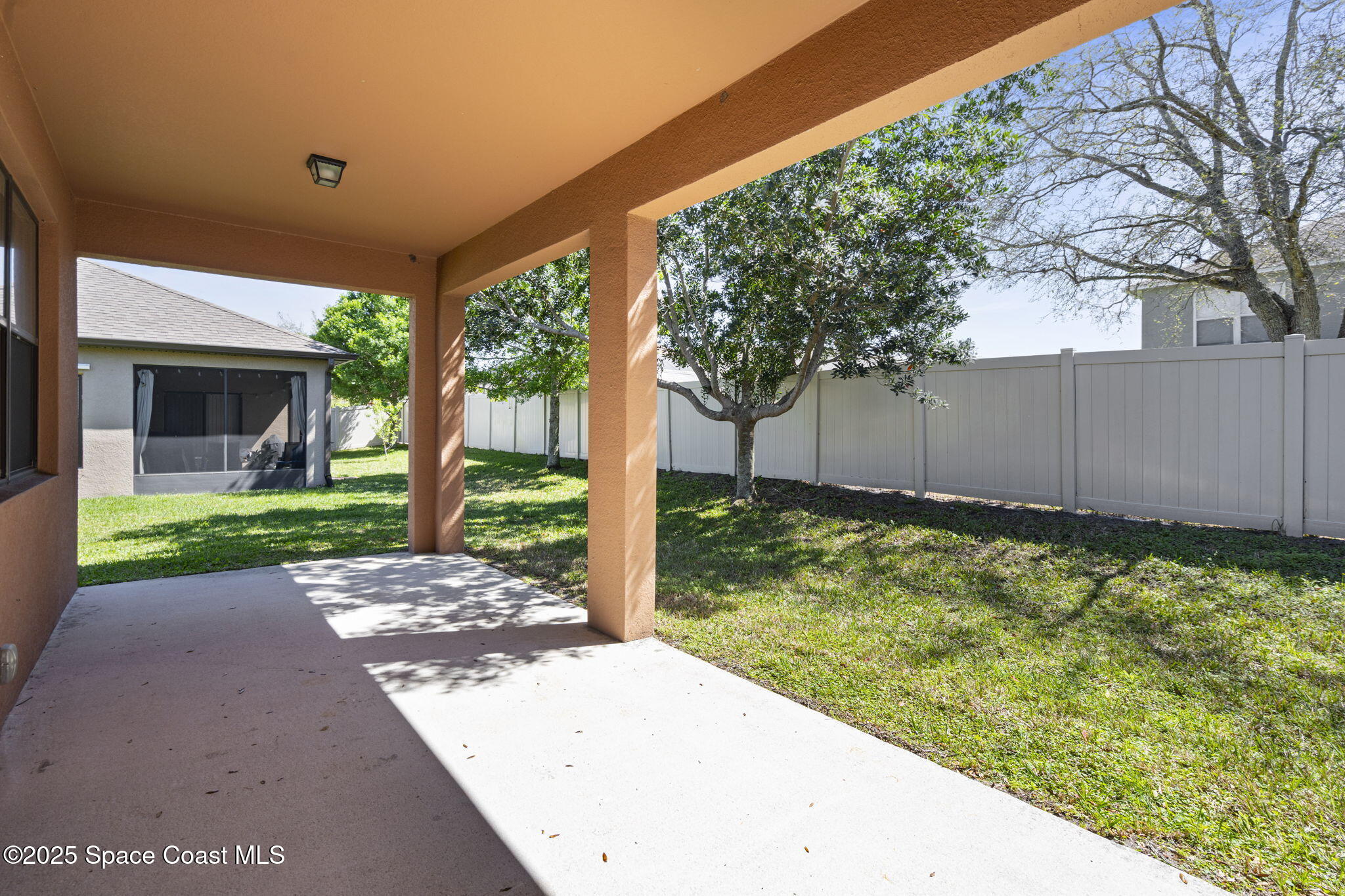 4015 Harvest Circle Rockledge, FL 32955 - Photo 35 of 40 a view of a backyard with tree