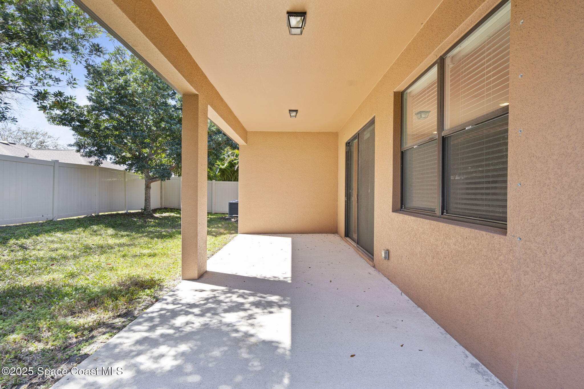 4015 Harvest Circle Rockledge, FL 32955 - Photo 37 of 40 a view of a back yard from a corridor