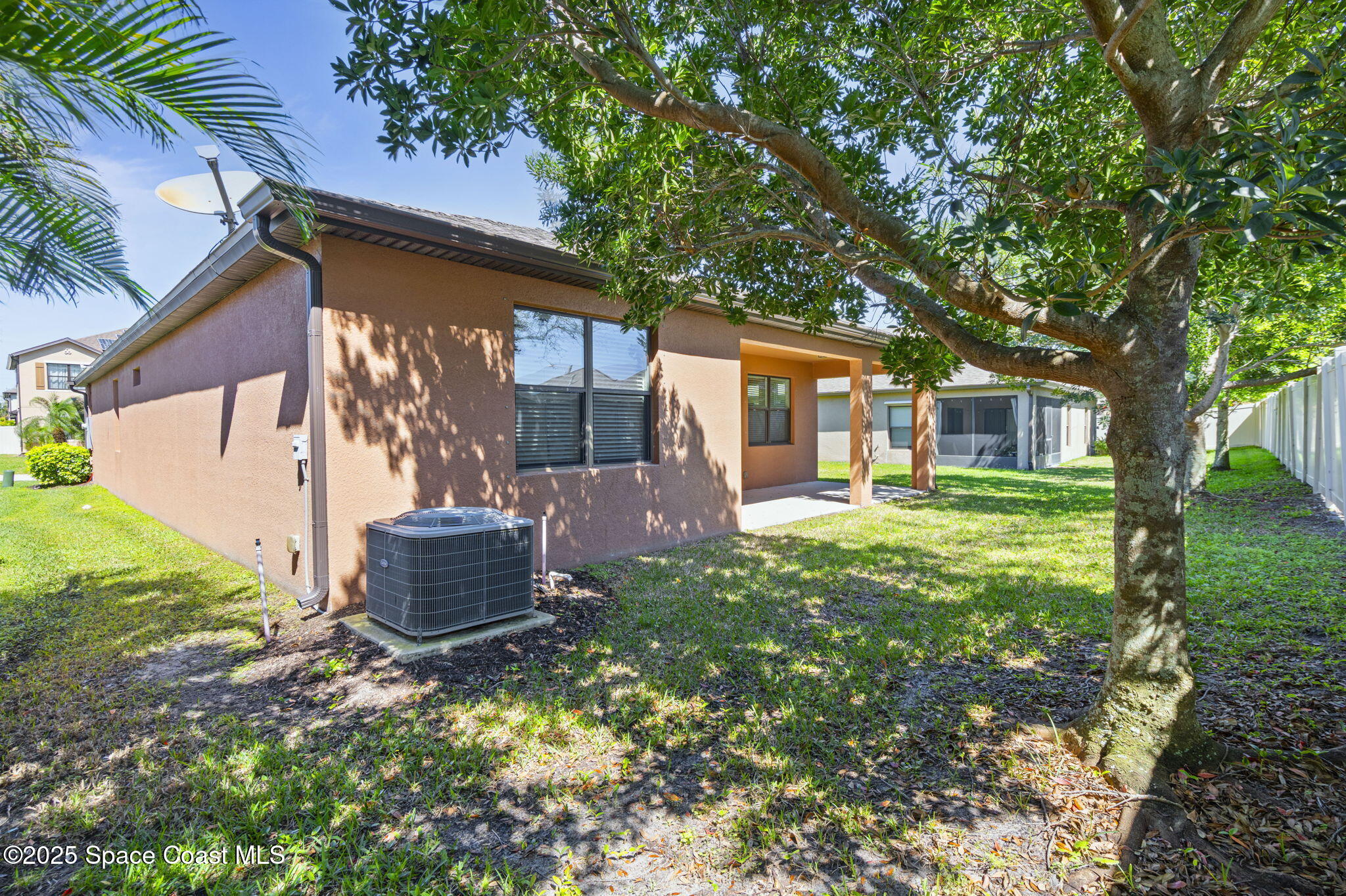4015 Harvest Circle Rockledge, FL 32955 - Photo 40 of 40 a backyard of a house with seating space