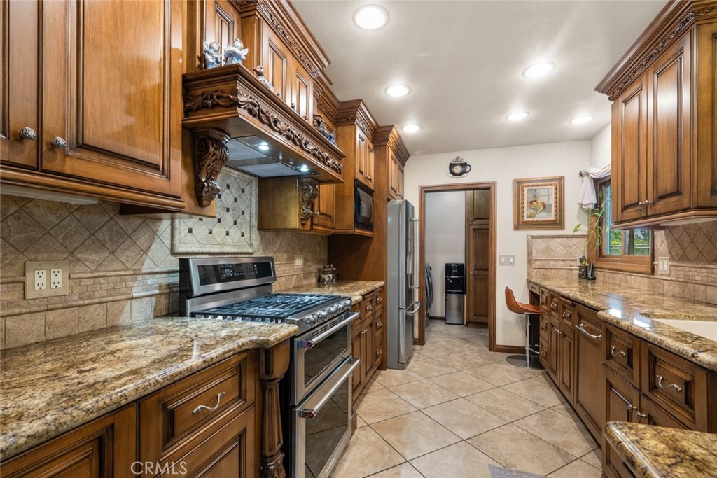 924 Crestview Drive Pasadena, CA 91107 - Photo 11 of 33 a kitchen with stainless steel appliances granite countertop a stove and a sink