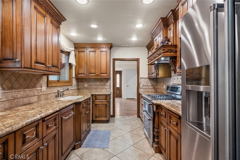 924 Crestview Drive Pasadena, CA 91107 - Photo 14 of 33 a kitchen with stainless steel appliances granite countertop a sink and a stove