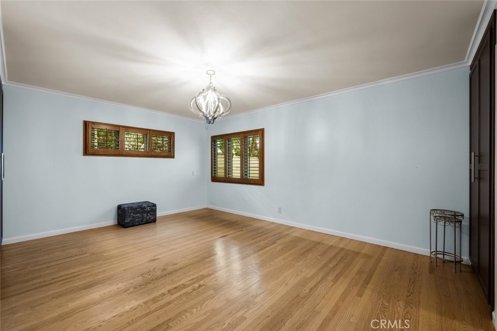924 Crestview Drive Pasadena, CA 91107 - Photo 19 of 33 a view of an empty room with wooden floor and window
