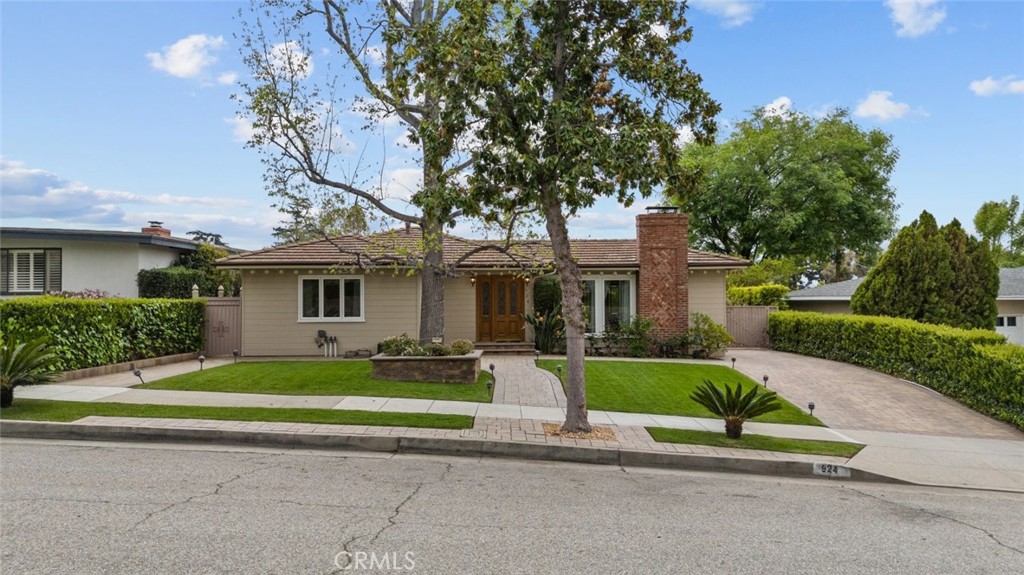 924 Crestview Drive Pasadena, CA 91107 - Photo 2 of 33 a front view of a house with a yard and garage