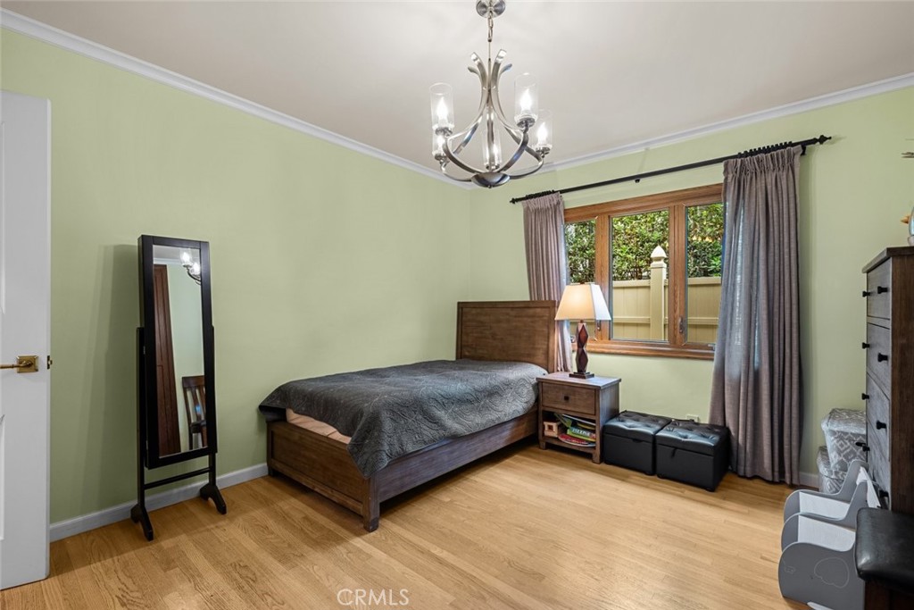 924 Crestview Drive Pasadena, CA 91107 - Photo 23 of 33 a living room with a bed furniture and a chandelier